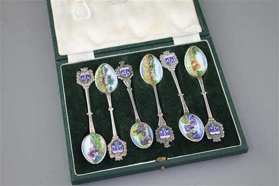 Six white metal and enamel teaspoons, decorated with Nairobi safari scenes with animals, unmarked, 11.2cm, gross 2.9oz.